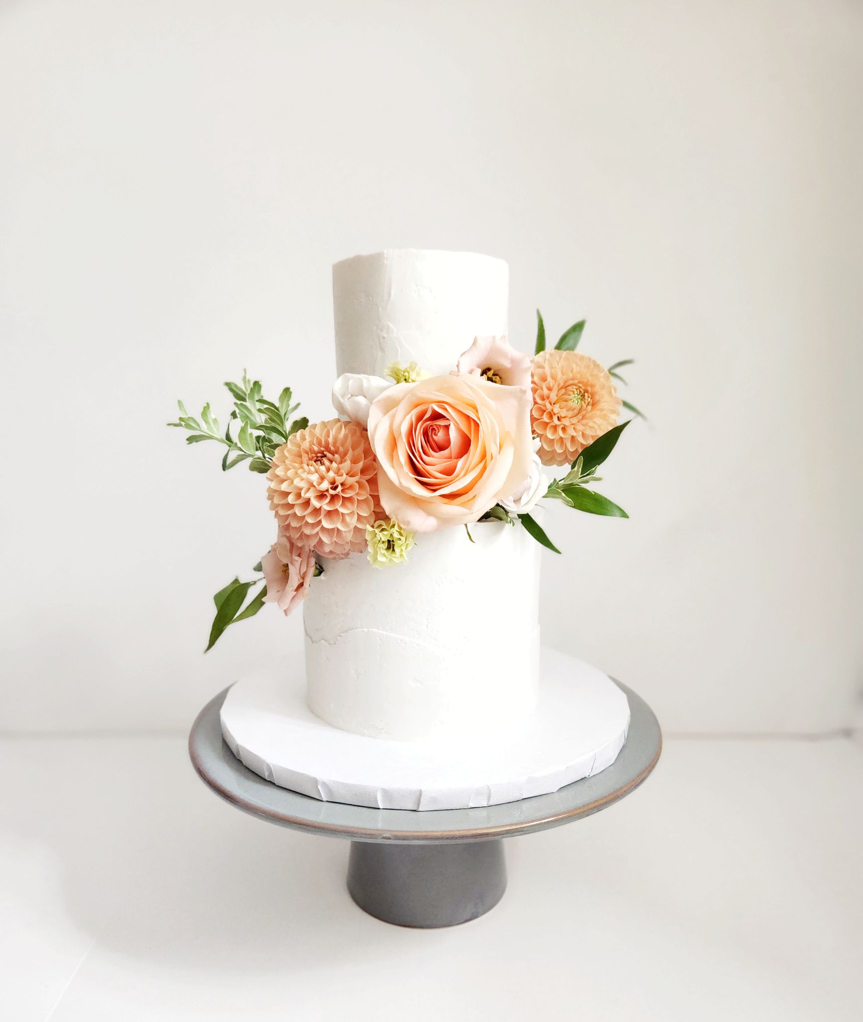 Peach florals · Floral wedding cake